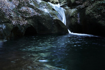 Deep green mountains and deep waterfalls.
