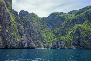 A majestic landscape of unique limestone cliffs natural formation in El Nido, Palawan, Philippines. A deep blue ocean and lake is the most famous tourist destination in Asia