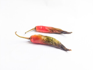 Rotten red chili with black color at the tip of the fruit