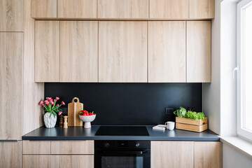 Modern kitchen interior featuring elegant decor and vibrant food arrangements