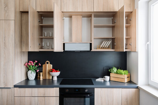 Modern kitchen interior featuring stylish cabinets and a sleek countertop