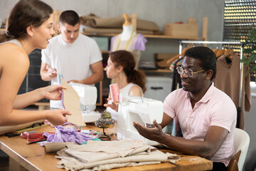 Students communicate during practical classes at cutting and sewing courses, discuss results of...