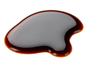 Glossy liquid sauce on a white surface.