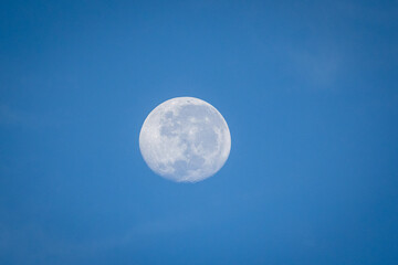 Close up image of a full moon during the day
