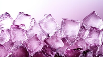 Fototapeta premium This stunning image showcases sparkling purple ice cubes against a soft gradient background, offering a refreshing and luxurious aesthetic suitable for various design applications.