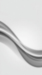 Abstract blurry gray curved shape on white background with gradient effect and slightly grainy texture