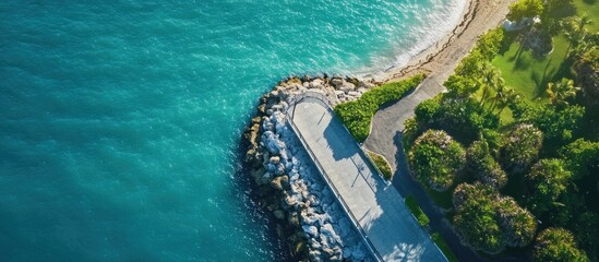 Aerial view of a coastal walkway and seawall