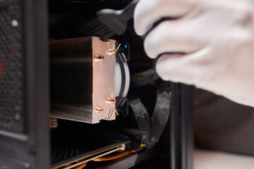 Cleaning a processor fan with a brush
