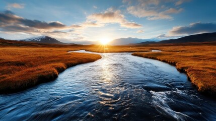 A stunning sunset casts golden hues over a winding river that flows through serene landscapes, inviting viewers to appreciate the beauty of nature in its purest form.