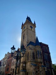 Historic Clock Tower Stands Tall Against a Clear Blue Sky in City Square