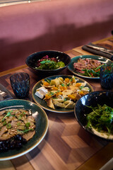 A gourmet dish with bread and fresh, flavorful ingredients elegantly arranged on a plate