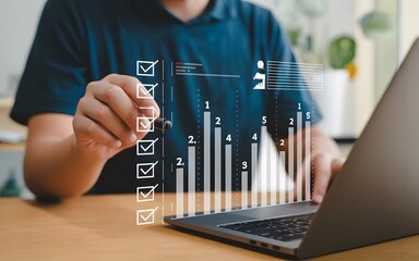 Businessman utilizing technology to analyze data and statistics through digital checklist and graph visualizations on laptop screen