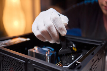 Cleaning a processor fan with a brush