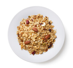 Granola in a plate close-up on a white. Top view