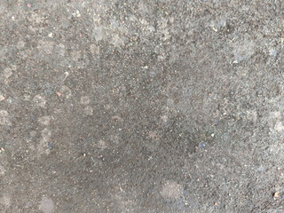 Close-up of a rough, gray concrete surface.
