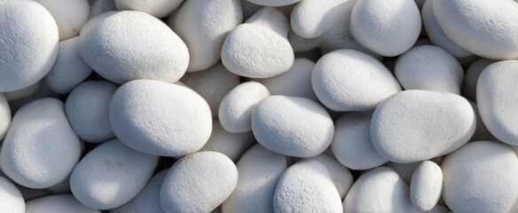 The collection of smooth white pebbles arranged elegantly on a surface.