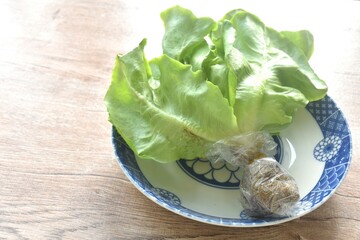 fresh green cos or  Romaine lettuce vegetable salad with drop of water arranging on plate