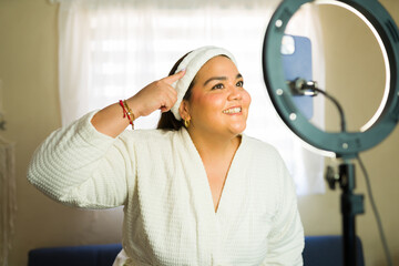 Influencer creating beauty content for social media with ring light