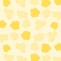 Seamless cartoon popcorn pattern with hand-drawn, irregular shapes in soft yellow tones. Suitable for snack packaging, textile design, or children’s backgrounds.