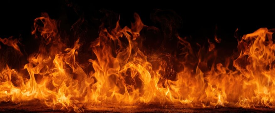 The dynamic flames dancing against a dark background creating dramatic visuals.