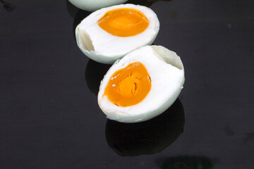 salted  egg on a black plate