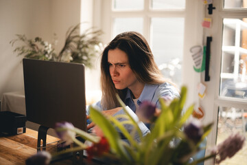 Frustrated annoyed woman confused by computer problem, annoyed businesswoman feels indignant about laptop crash, bad news online or disgusting video on web, stressed freelancer looking at broken pc.