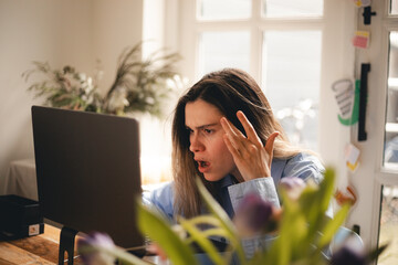 Frustrated annoyed woman confused by computer problem, annoyed businesswoman feels indignant about laptop crash, bad news online or disgusting video on web, stressed freelancer looking at broken pc.