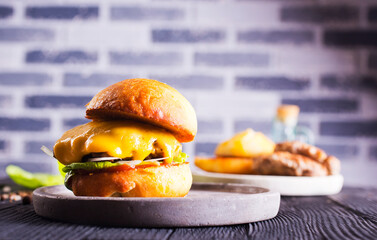 Close up cheese burger on wooden background.