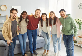 Fototapeta premium Friends diverse team, happy unity common group hug, community supporting each other, following teambuilding joy and amuse, old friends and classmates reunion, coming together to enjoy friendly time 