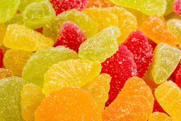 Colorful gummy candies in assorted shapes and flavors on display for a sweet treat experience