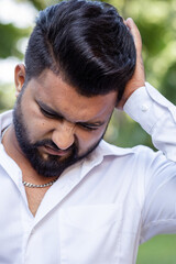 South Asian, Indian man having one-side migraine headache