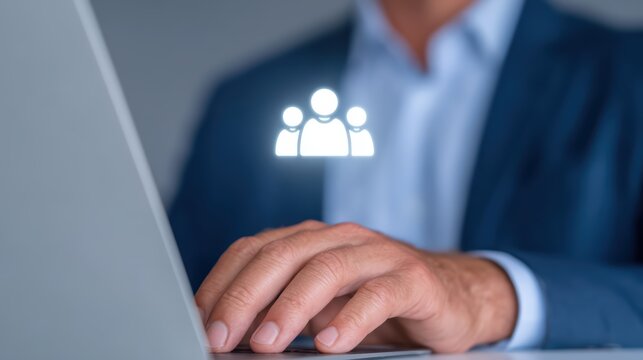 Professional Businessman Working on Laptop with Team Collaboration Icon Overlay in Modern Office Environment