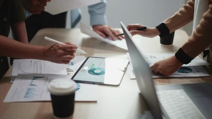 Business People Meeting using laptop computer, calculator,notebook,stock market chart paper for analysis Plans to improve quality next month. - Powered by Adobe