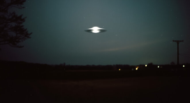 Blurry "found footage" photo of a UFO at night. Mysterious, grainy image of a flying saucer.