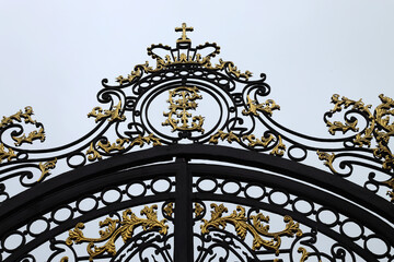 Saint Petersburg, Russia, August 22, 2024: A fragment of the gilded gate at the entrance to the...
