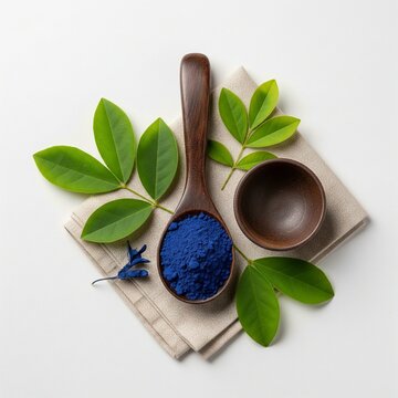 Nila Powder in Wooden Spoon on White Backgroundspa still life