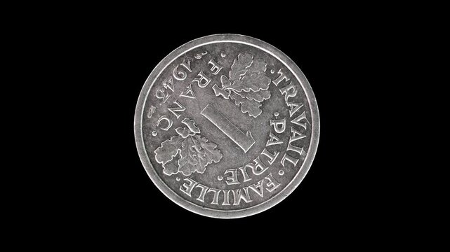 France 1943 1 franc coin reverse with oak leaves and denomination rotating on black background