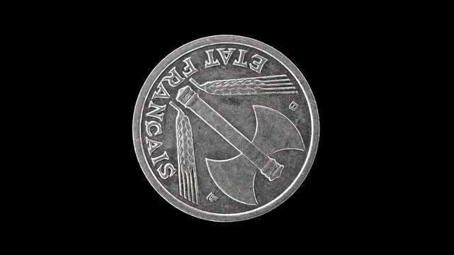 France 1943 1 franc coin obverse with axe fasces and inscription &Eacute;tat Fran&ccedil;ais rotating on black background