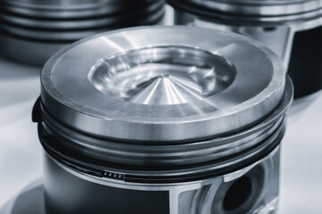 engine  piston with cone shaped top. auto service concept background