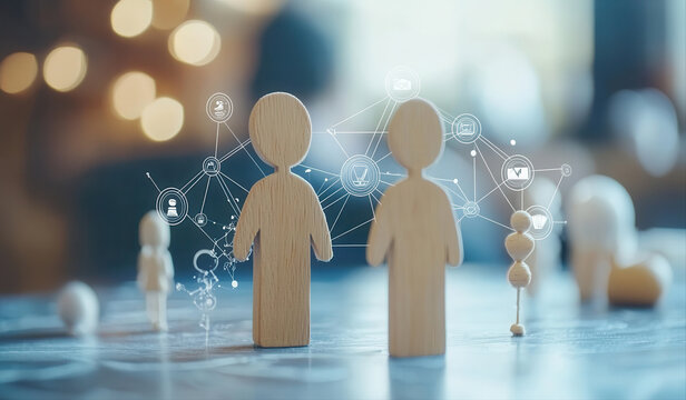 Two wooden figures standing close together, connected by digital network