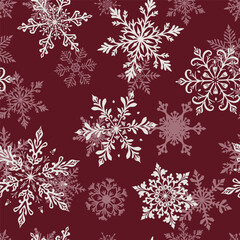 Christmas seamless pattern with two layers of large intricate snowflakes in various designs, white on red background.