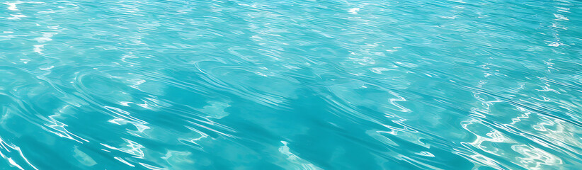 Clear turquoise water surface with sun reflections &ndash; tropical sea background