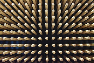 Unique Abstract View of Wooden Sticks Arranged in a rectangular pattern on black background © Max