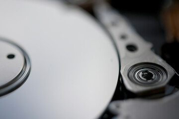 computer hard disk in close-up, disassembled, view inside, computer memory disk