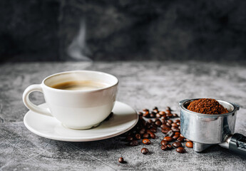 Aromatic Coffee cup and beans with ground coffee on Portafilter, Espresso coffee cup aromatic and...