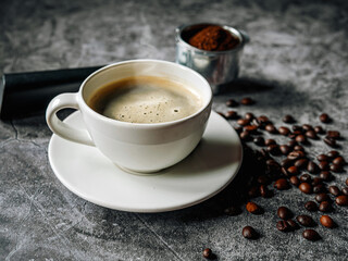 Aromatic Coffee cup and beans with ground coffee on Portafilter, Espresso coffee cup aromatic and making equipment