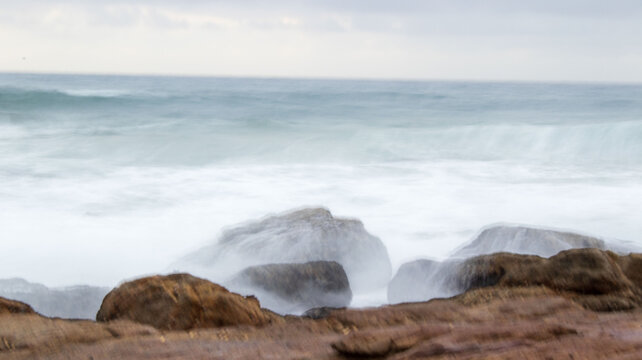 waves crashing on rocks