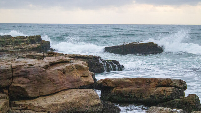 waves crashing on rocks