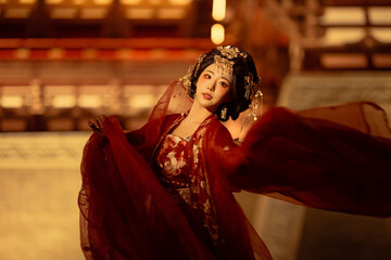 Elegant woman in flowing red attire with traditional decor Chinese word means woman.