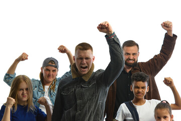 A diverse group stands united in protest, raising fists with determined expressions against a white...